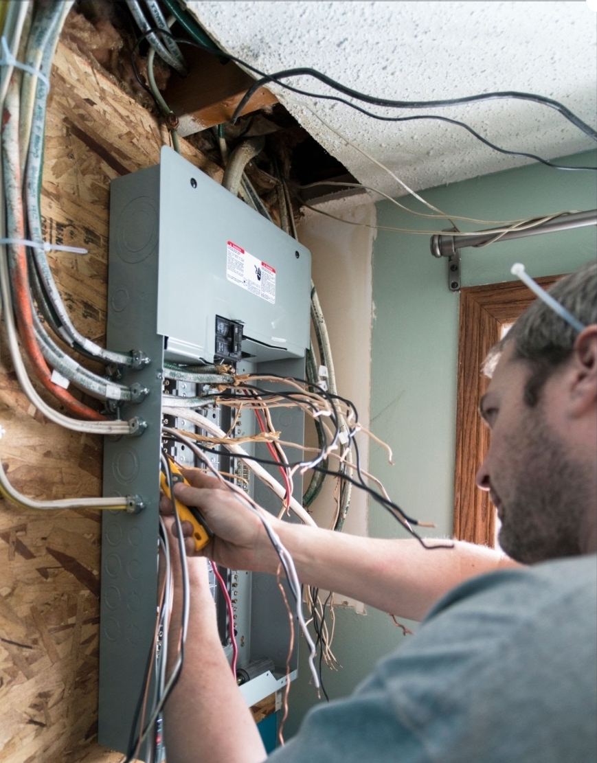 Electrician working on a residential electrical panel